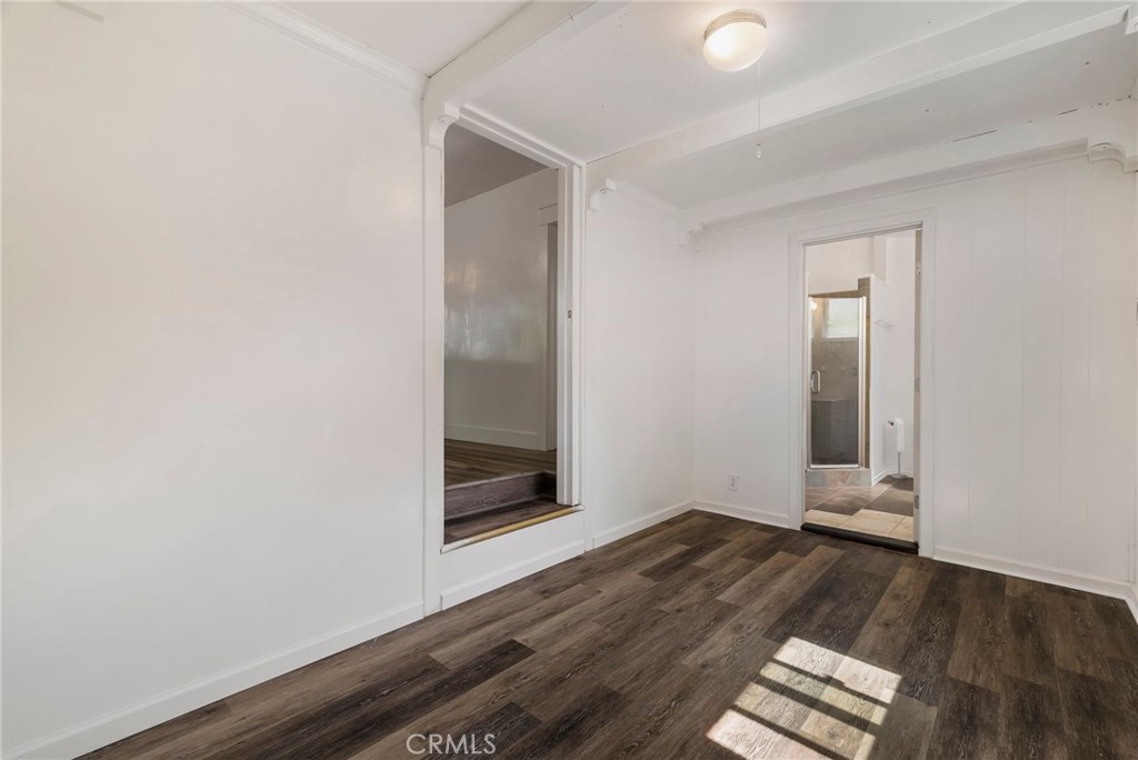 1617 Hemlock Street Chico, CA 95928 - Photo 18 of 60 an empty room with wooden floor and windows