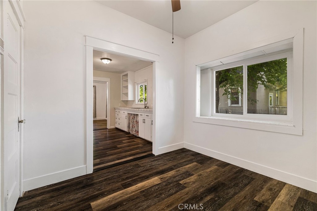 1617 Hemlock Street Chico, CA 95928 - Photo 19 of 60 a view of a room with wooden floor staircase and a kitchen space