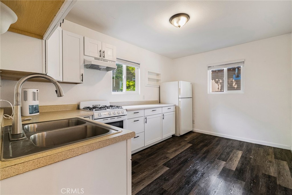 1617 Hemlock Street Chico, CA 95928 - Photo 39 of 60 a kitchen that has a sink cabinets counter space and stainless steel appliances