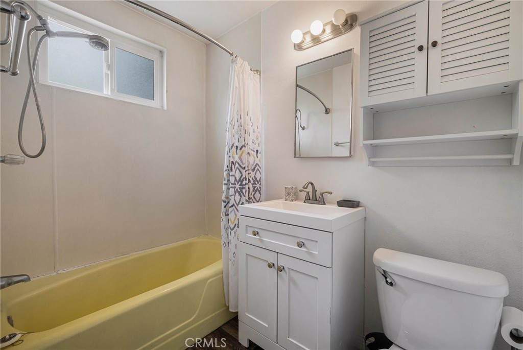 1617 Hemlock Street Chico, CA 95928 - Photo 44 of 60 a bathroom with a sink a toilet and shower