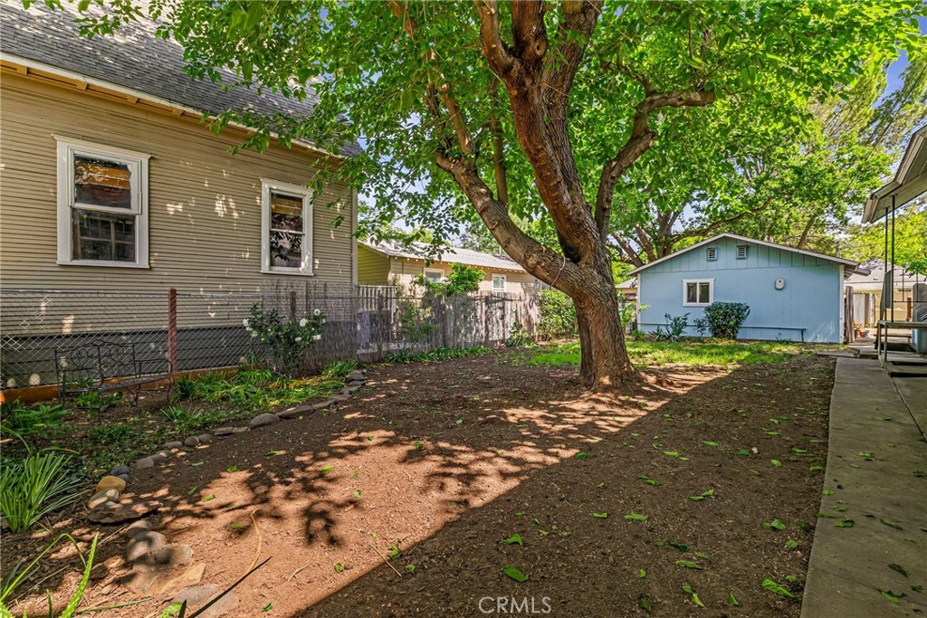 1617 Hemlock Street Chico, CA 95928 - Photo 47 of 60 a front view of a house with a yard and garage