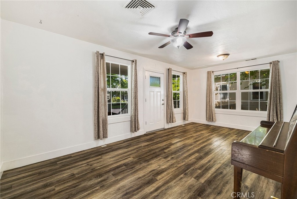 1617 Hemlock Street Chico, CA 95928 - Photo 6 of 60 a view of a livingroom with a hardwood floor and a ceiling fan