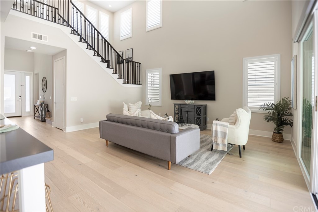 63 Crater Irvine, CA 92618 - Photo 13 of 34 a living room with furniture and a flat screen tv
