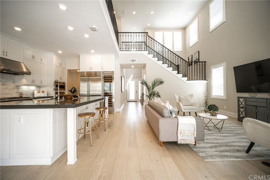 63 Crater Irvine, CA 92618 - Photo 15 of 34 a living room with furniture and a flat screen tv
