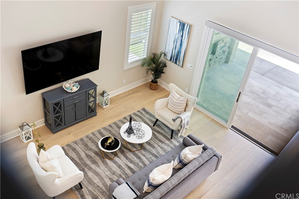 63 Crater Irvine, CA 92618 - Photo 16 of 34 a living room with furniture and a flat screen tv