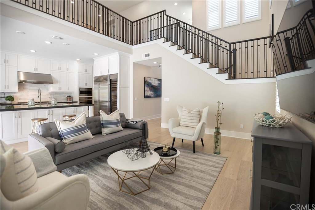 63 Crater Irvine, CA 92618 - Photo 17 of 34 a living room with furniture and wooden floor