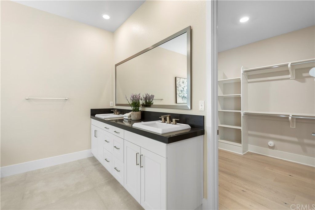 63 Crater Irvine, CA 92618 - Photo 20 of 34 a bathroom with a sink and a mirror