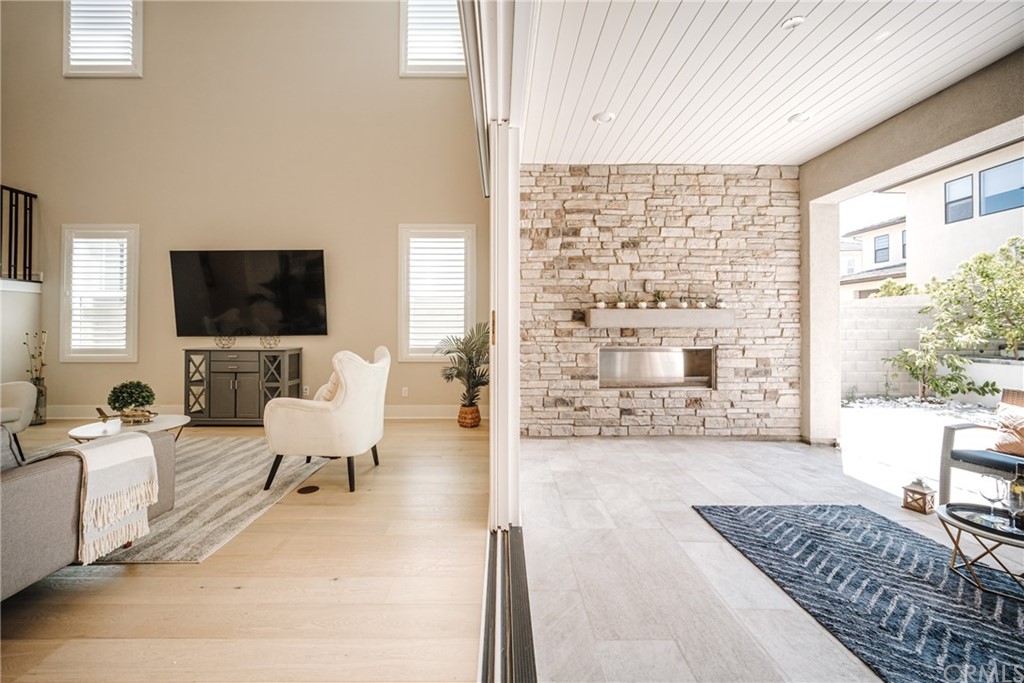 63 Crater Irvine, CA 92618 - Photo 28 of 34 a living room with furniture and a flat screen tv