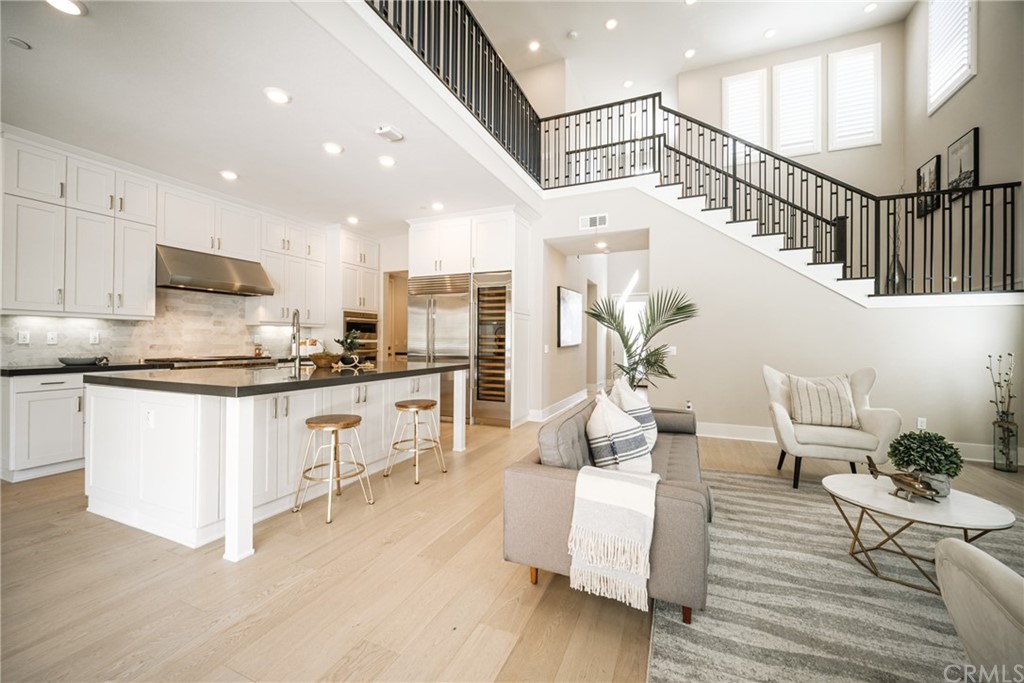 63 Crater Irvine, CA 92618 - Photo 3 of 34 a kitchen with white cabinets and refrigerator