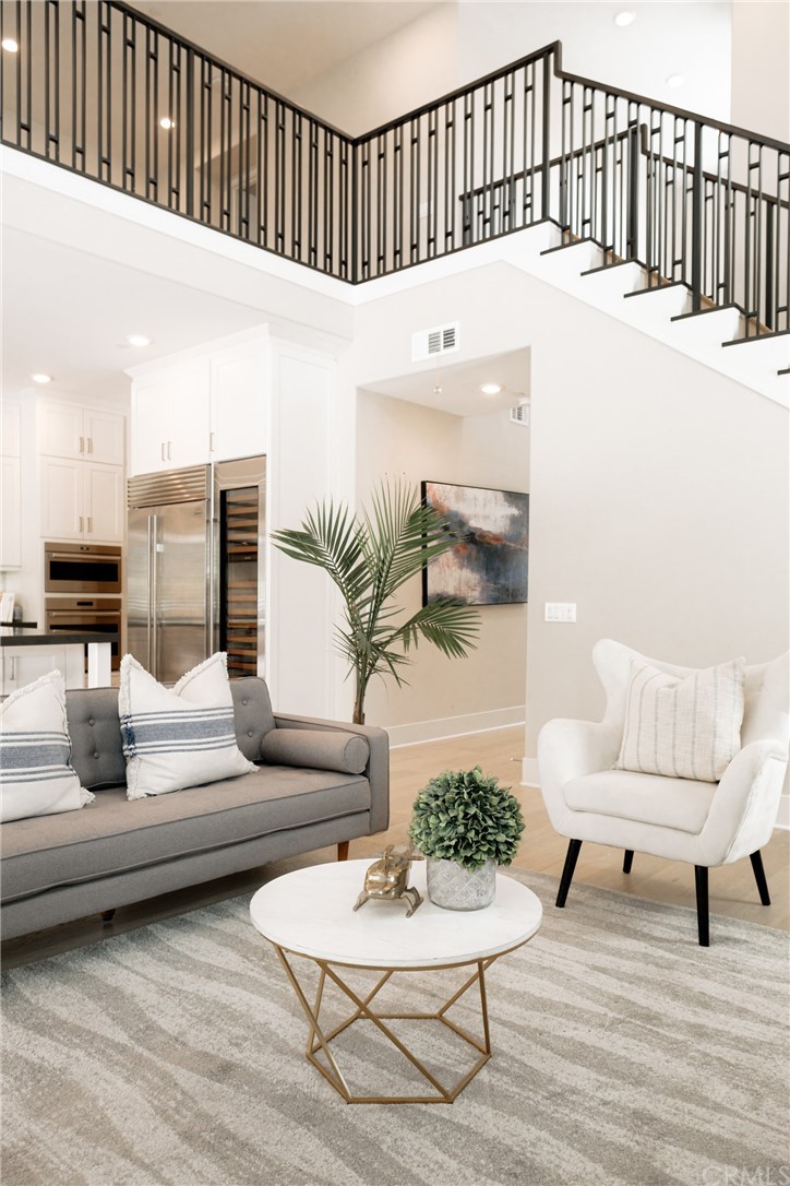 63 Crater Irvine, CA 92618 - Photo 31 of 34 a living room with furniture and wooden floor