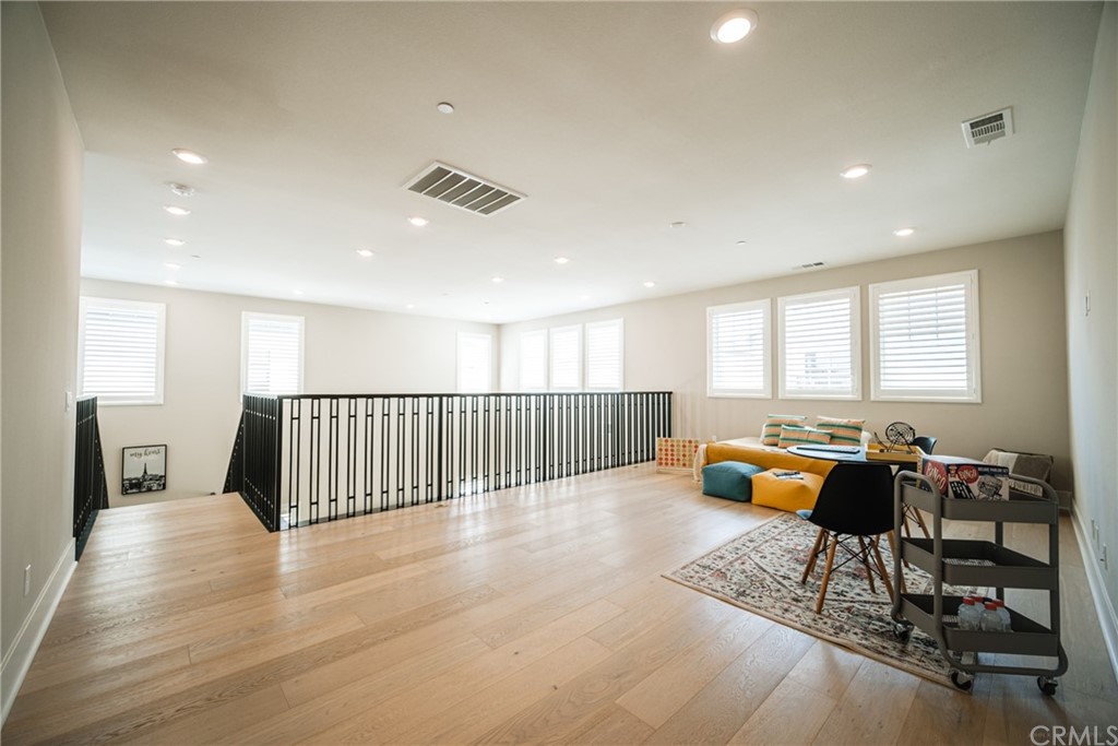 63 Crater Irvine, CA 92618 - Photo 32 of 34 a lobby with furniture and wooden floor
