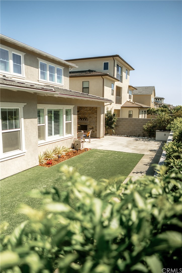 63 Crater Irvine, CA 92618 - Photo 33 of 34 a front view of a house with a yard