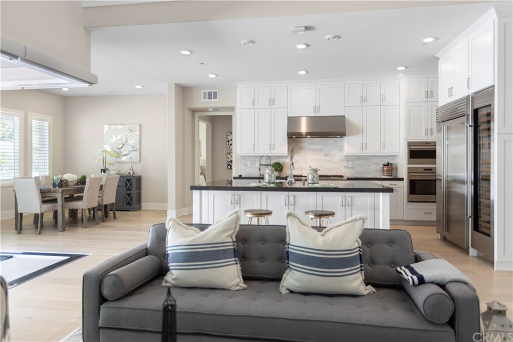 63 Crater Irvine, CA 92618 - Photo 5 of 34 a living room with stainless steel appliances furniture and a kitchen view