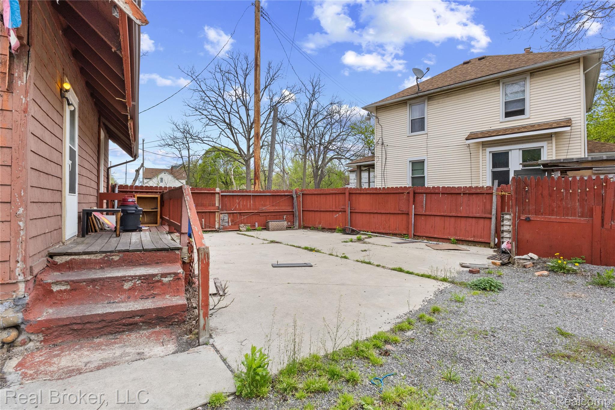 352 Perry Street Pontiac, MI 48342 - Photo 7 of 30 Fenced backyard with a deck and a gate