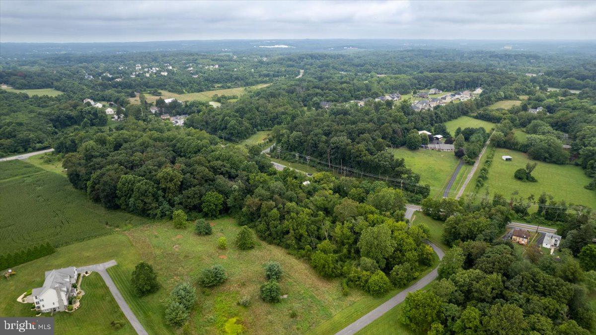 14459 Frederick Road Cooksville, MD 21723 - Photo 20 of 29 an aerial view of residential houses with outdoor space and trees