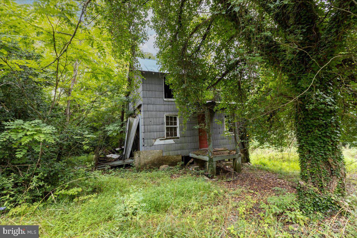 14459 Frederick Road Cooksville, MD 21723 - Photo 29 of 29 a view of a house with backyard garden and sitting area