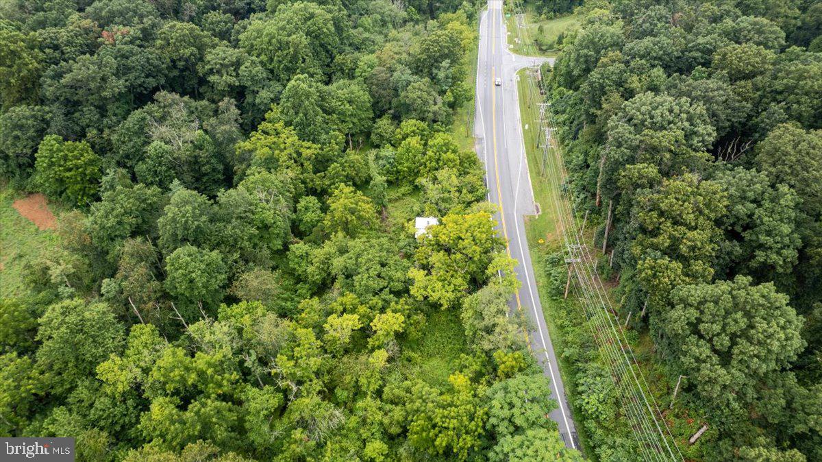 14459 Frederick Road Cooksville, MD 21723 - Photo 3 of 29 an aerial view of residential house with space and trees all around