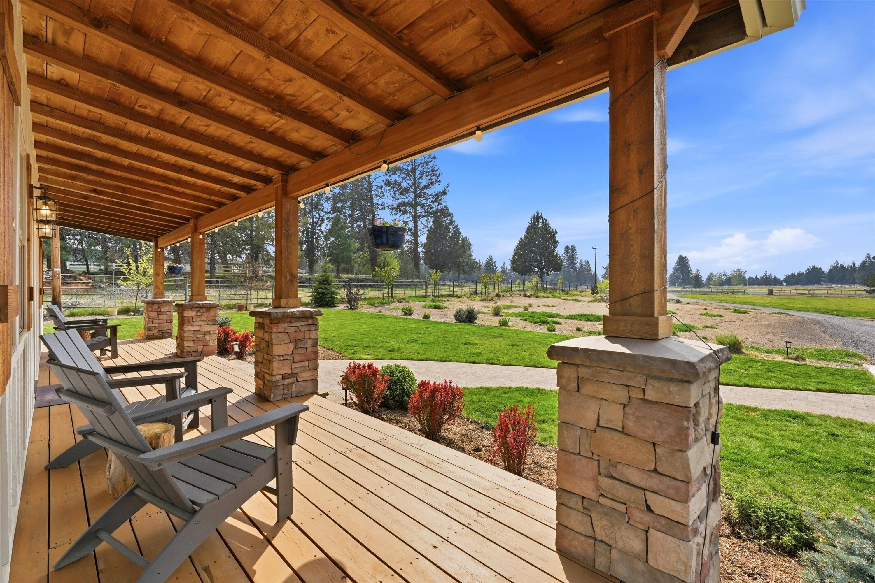 61280 Larsen Road Bend, OR 97702 - Photo 3 of 58 a view of a patio with dining table and chairs