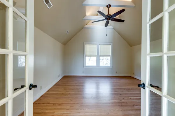 a bathroom with a shower and a sink
