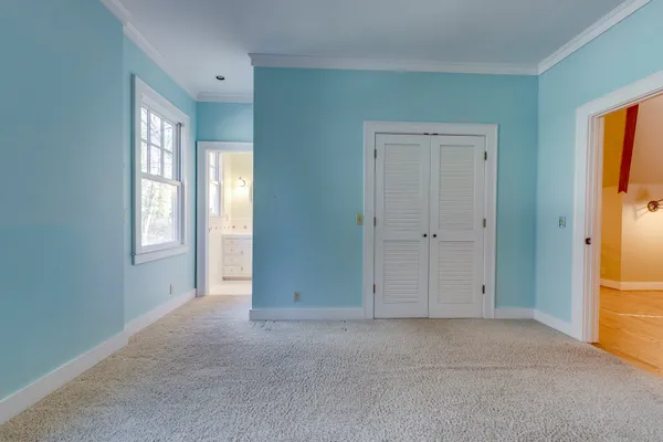 a bedroom with a bed and a cabinets