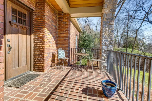 a view of a balcony with wooden floor