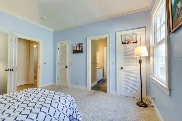 a living room with furniture and a ceiling fan