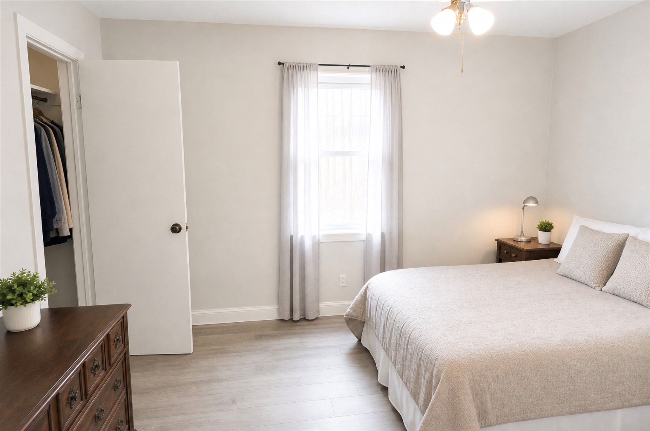 419 Fifth Street McLean, TX 79057 - Photo 25 of 34 a bedroom with a bed and a potted plant