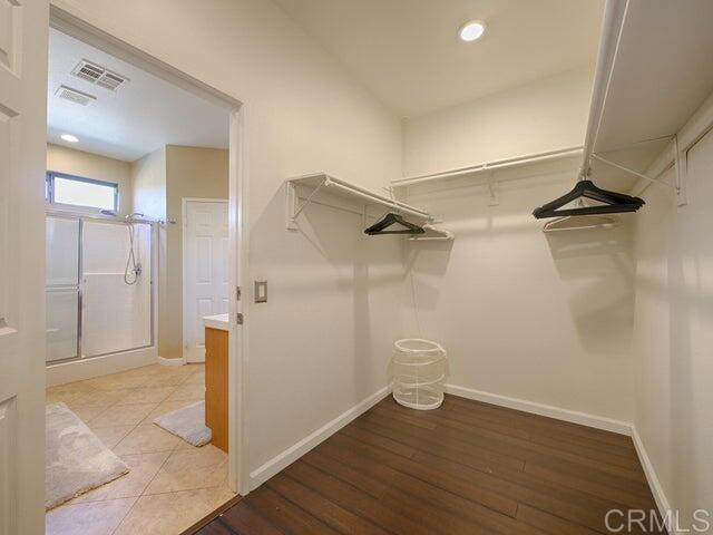80596 Key Largo Avenue Indio, CA 92201 - Photo 16 of 59 a view of a hallway with wooden floor and closet