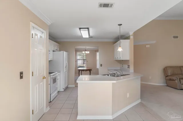 a view of livingroom with furniture ceiling fan and windows