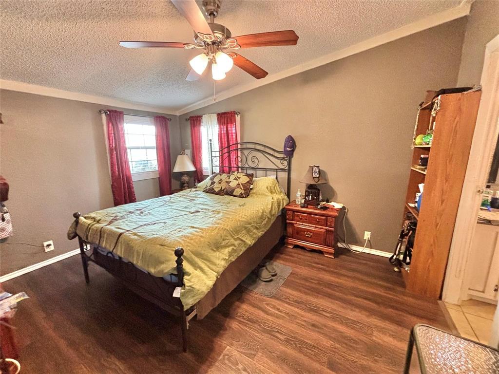 119 Overlook Trail Azle, TX 76020 - Photo 15 of 20 a bed sitting in a room next to a window
