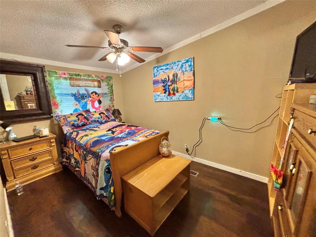 119 Overlook Trail Azle, TX 76020 - Photo 17 of 20 a bedroom with bed and wooden floor