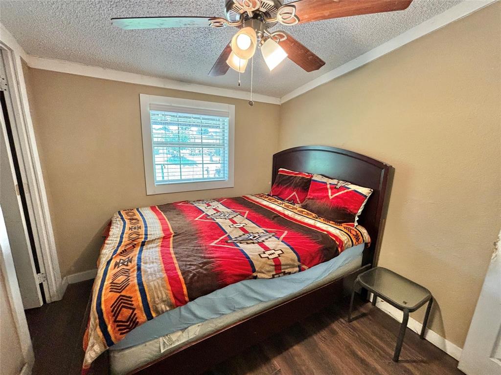 119 Overlook Trail Azle, TX 76020 - Photo 18 of 20 a bed sitting in a bedroom next to a window