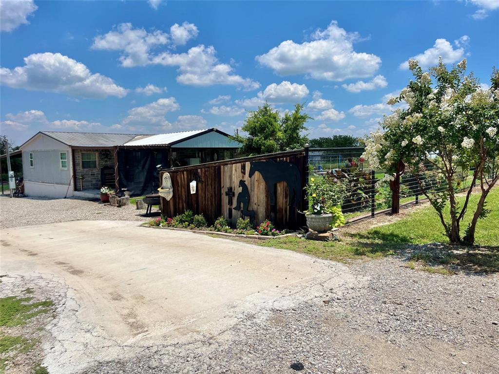 119 Overlook Trail Azle, TX 76020 - Photo 6 of 20 a view of a house with backyard and trees