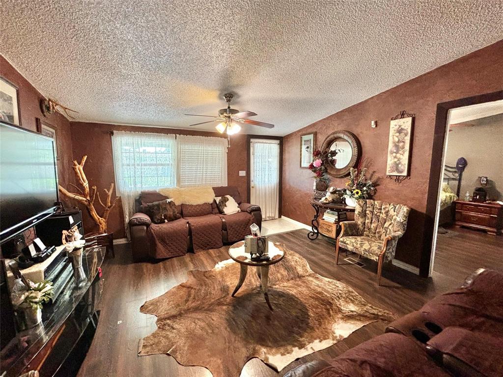 119 Overlook Trail Azle, TX 76020 - Photo 9 of 20 a living room with furniture and a flat screen tv