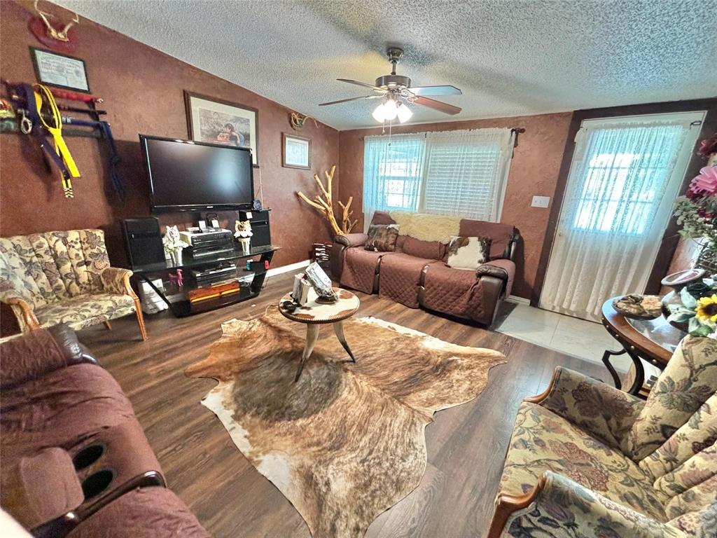 119 Overlook Trail Azle, TX 76020 - Photo 10 of 20 a living room with furniture and a flat screen tv
