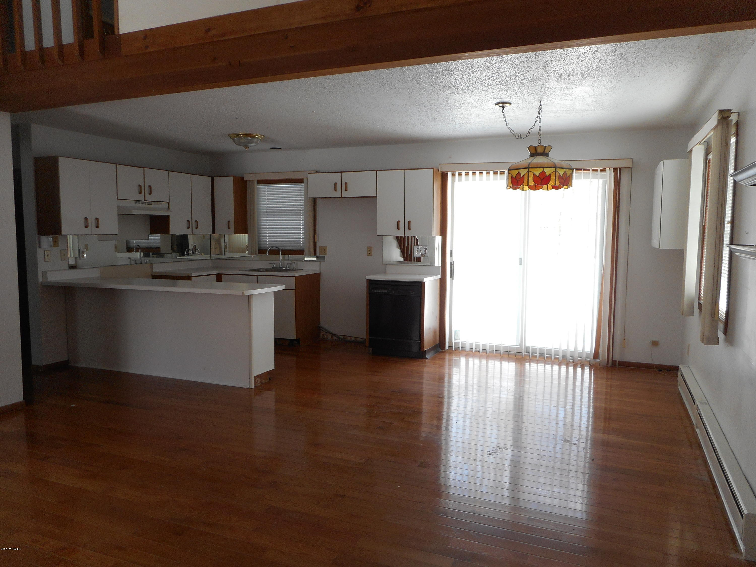 262 High Ridge Road Dingmans Ferry, PA 18328 - Photo 6 of 21 a kitchen with stainless steel appliances granite countertop a sink stove and refrigerator