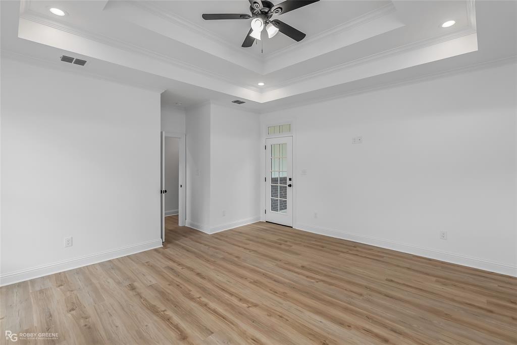 231 Ramsey Road Stonewall, LA 71078 - Photo 21 of 39 a view of empty room with wooden floor
