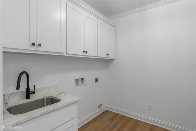a bathroom with a sink and cabinets