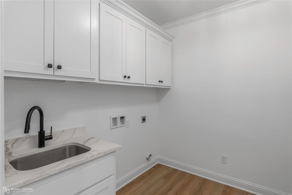 231 Ramsey Road Stonewall, LA 71078 - Photo 34 of 39 a bathroom with a sink and cabinets