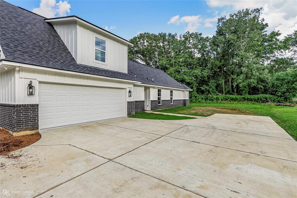 231 Ramsey Road Stonewall, LA 71078 - Photo 39 of 39 a view of garage and yard