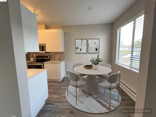 a dining room with furniture and window