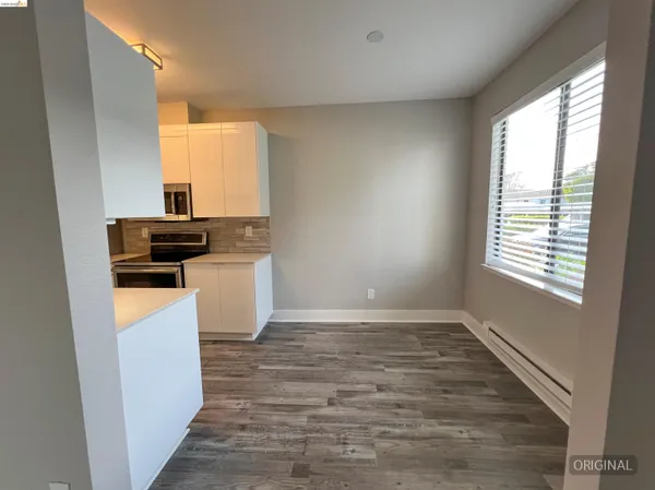 a view of a kitchen with a sink cabinets and a window