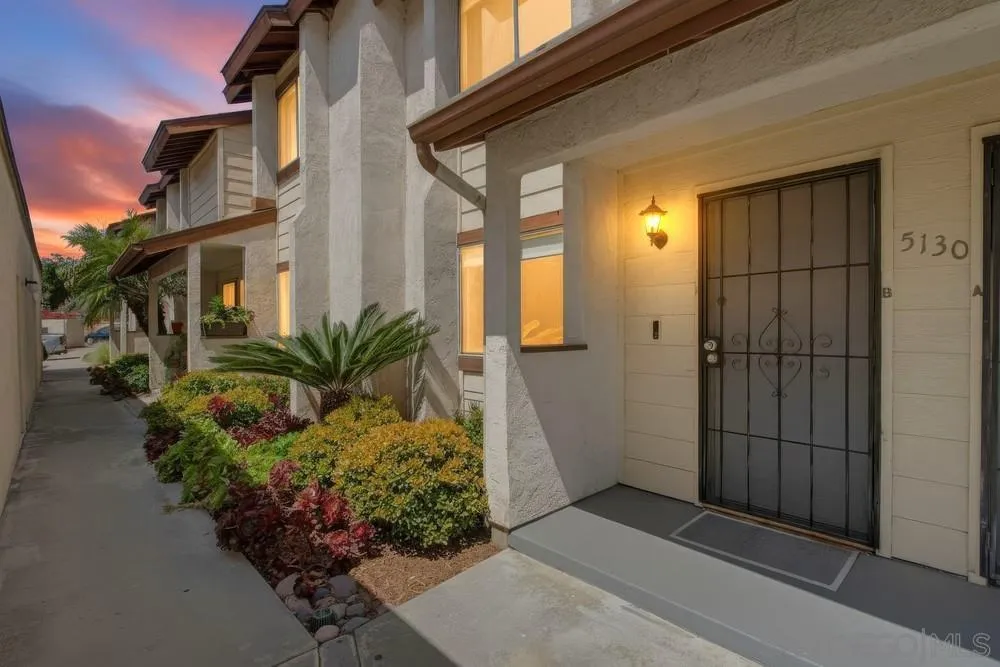 5130 North River Road, Unit B Oceanside, CA 92057 - Photo 12 of 51 a front view of a house with a yard