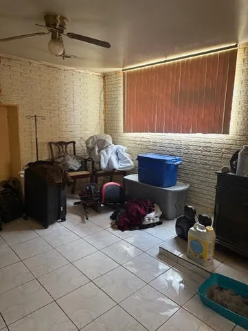 a living room with furniture a window and a rug