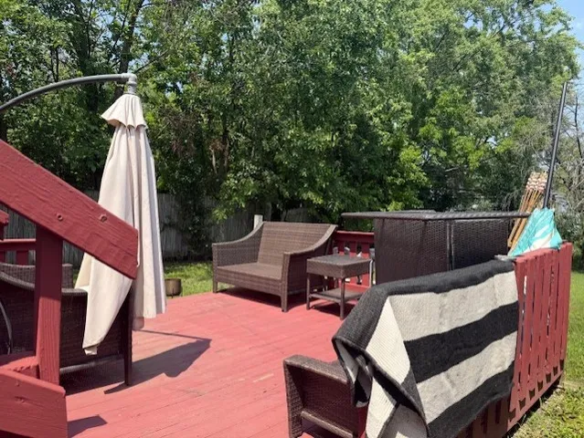 a view of a patio with a table and chairs