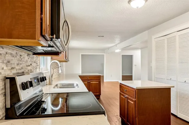 a view of living room with furniture and a fireplace