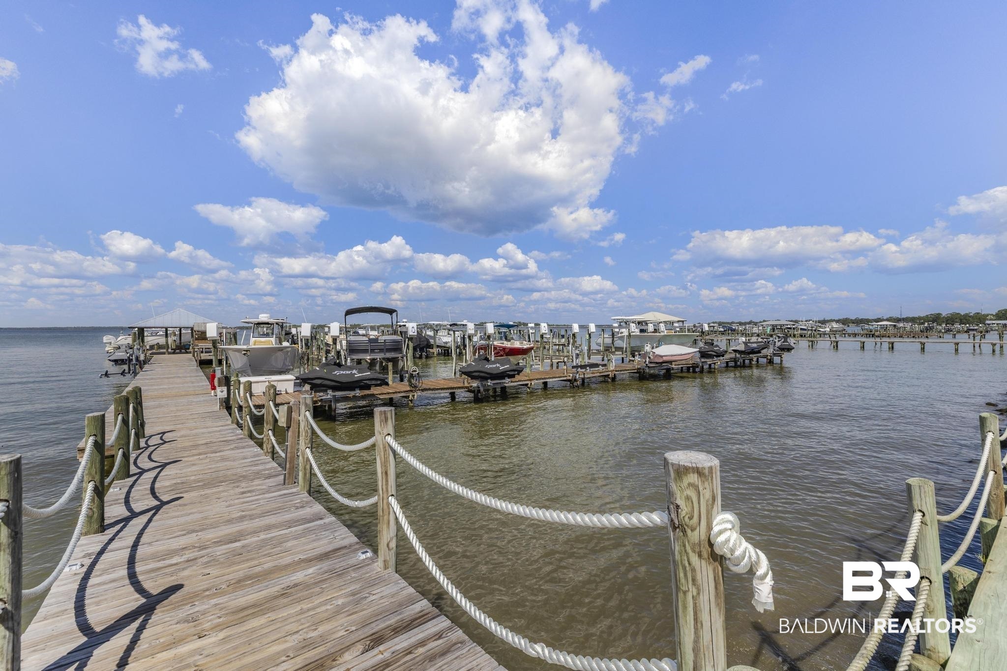 25773 Canal Road Orange Beach, AL 36561 - Photo 16 of 32 Dock with a water view and boat lift