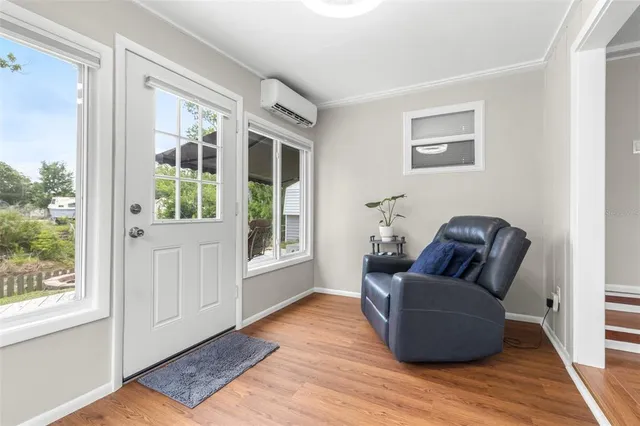 a living room with furniture and windows
