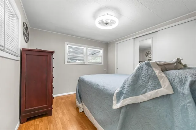 a bedroom with a bed and a dresser