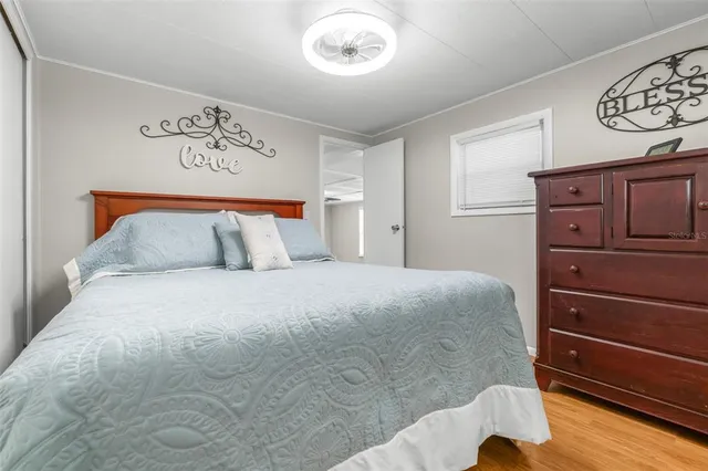 a bedroom with a bed and a closet